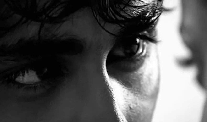 A man’s eye in black and white, looking away